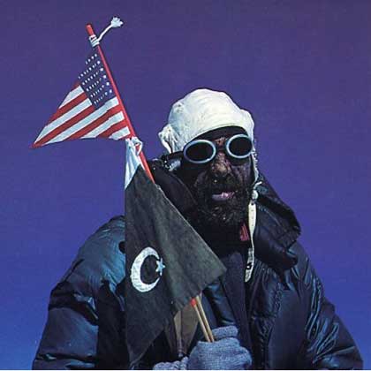 Gasherbrum I book - A Walk In The Sky - Andy Kauffman holds the American flag and the Pakistani flag on the summit of Gasherbrum I (Hidden Peak) after the first ascent on July 5, 1958